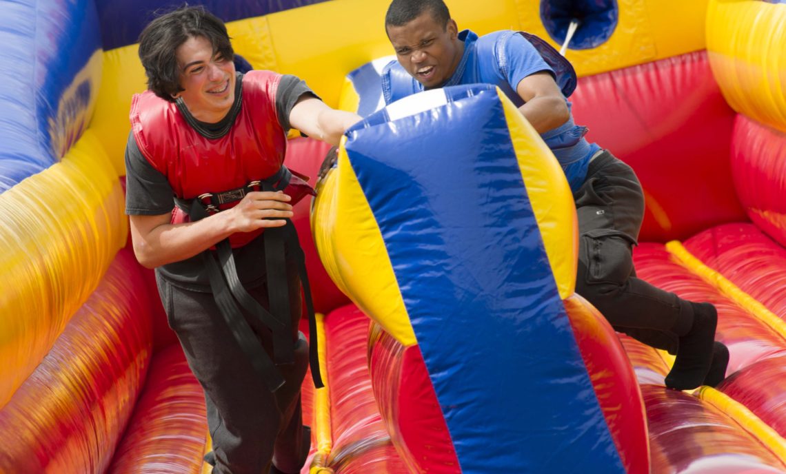 students run on a velcro bungee run