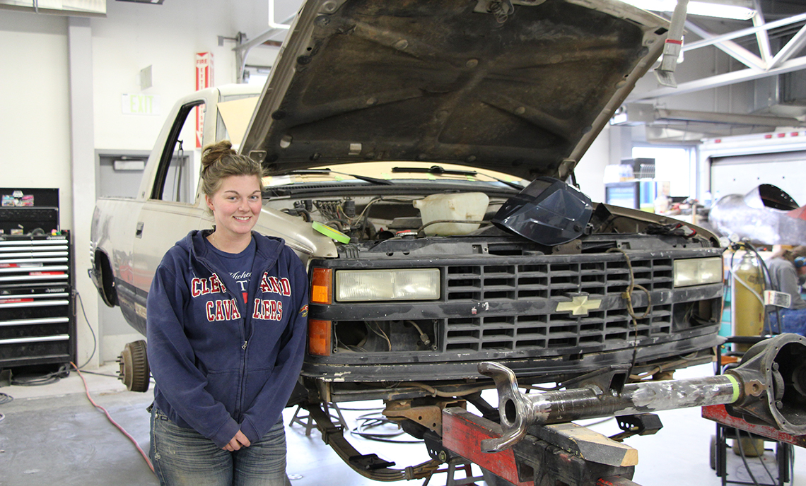 Ericka DeBoer is working on customizing her Chevrolet Blazer, cutting off the back to turn it into a truck and changing the axle to make it more conducive to off-road driving.