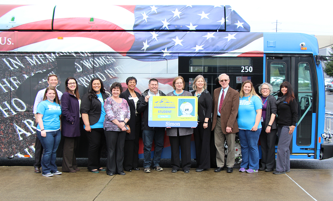 CPTC and Pierce Transit administrators and student leadership staff celebrate the unveiling of a new bus pass partnership Wednesday, April 12.