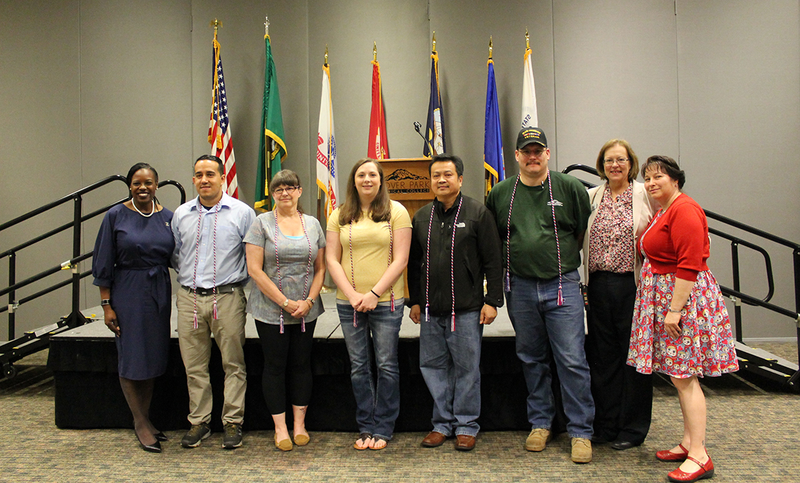 CPTC student honor cord recipients stand with keynote speaker Shellie Willis (left) and CPTC President Joyce Loveday and Veterans Resource Center Coordinator Hope Stout (right).