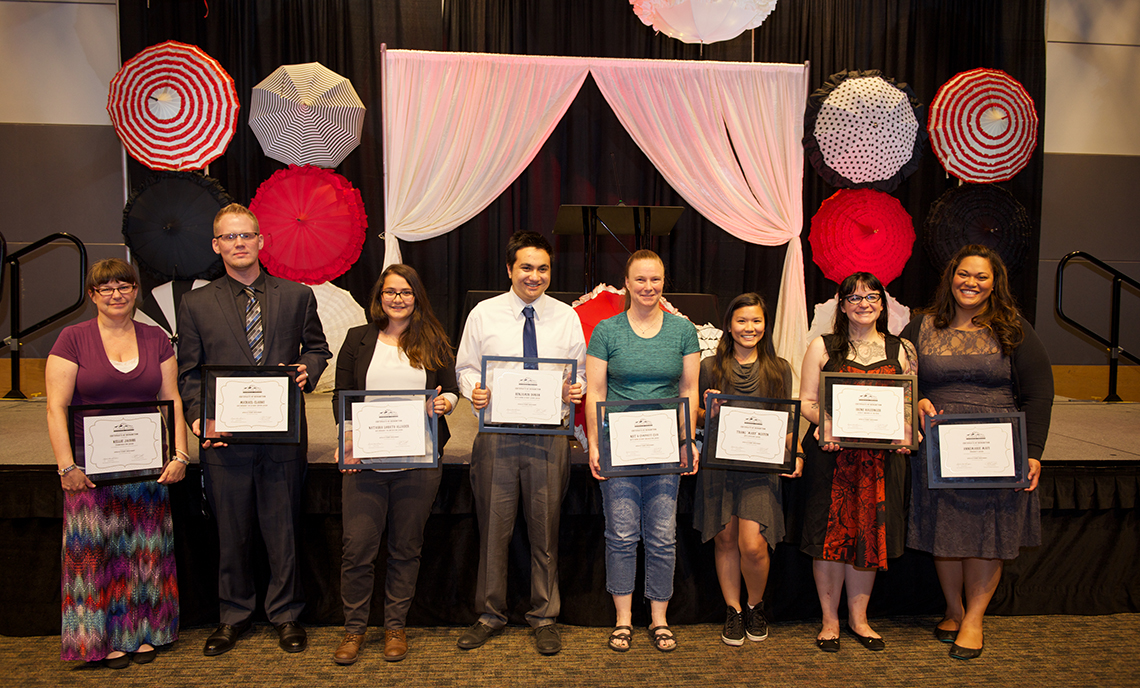 Award winners pose with their plaques following the conclusion of the Fifth Annual Student Awards Ceremony on June 7 in the McGavick Conference Center.