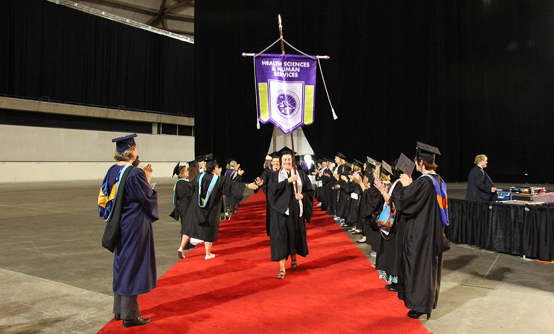 CPTC faculty form a tunnel of support as graduates make their way to the Tacoma Dome floor for the 21st Commencement Ceremony on June 20.