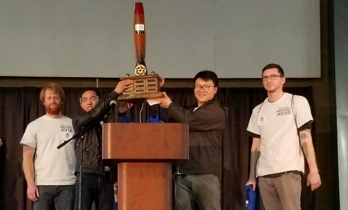 Clover Park Technical College's Aviation Maintenance Technician competition team holds up the trophy after winning the skills competition at the 2018 Northwest Aviation Conference & Trade Show on Feb. 24.