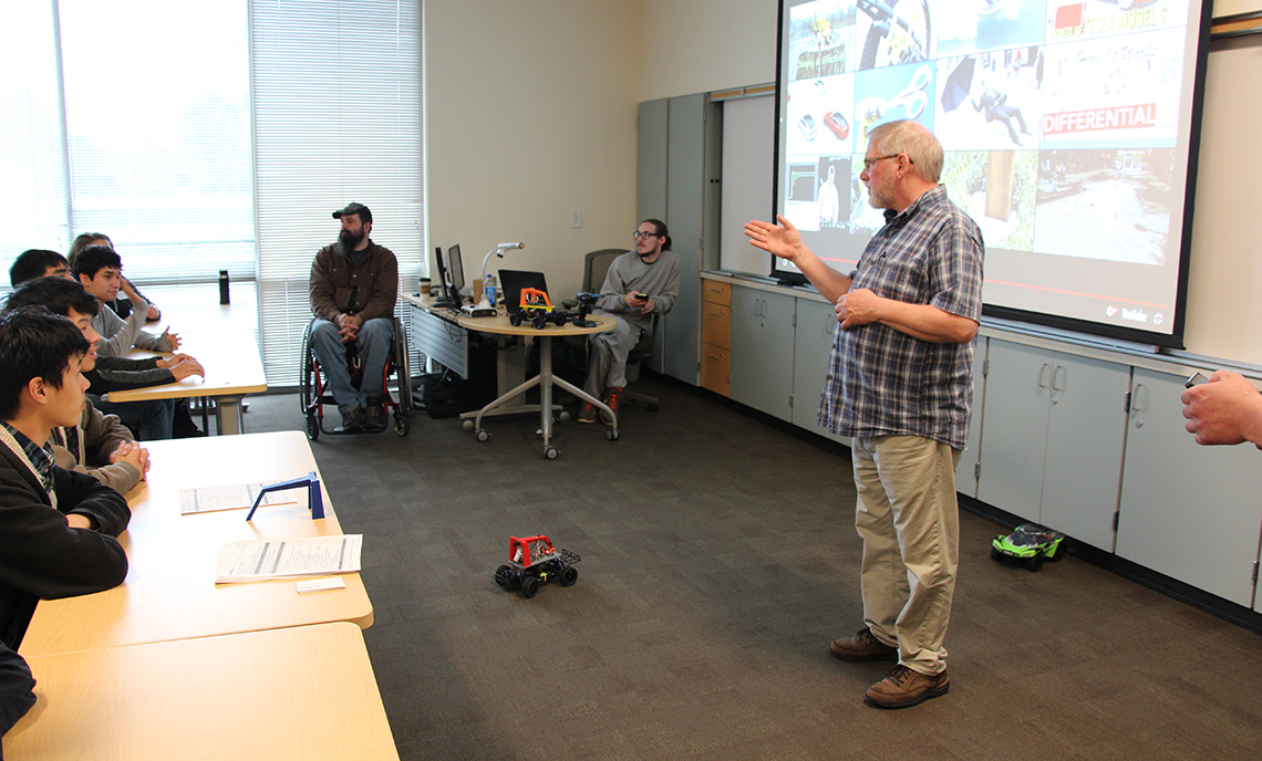 CPTC Computer Programming instructor Ken Meerdink leads a breakout session showcasing the "Donkey Car" built by the his program to transform ordinary remote control cars into autonomous vehicles.