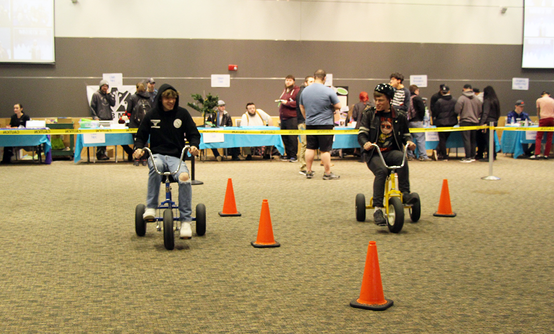 Winter Fest attendees race on the oversize tricycles.