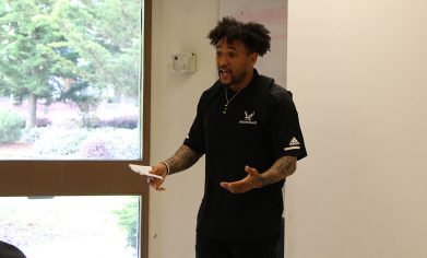 Vernon Adams, Jr., speaking to a class of students