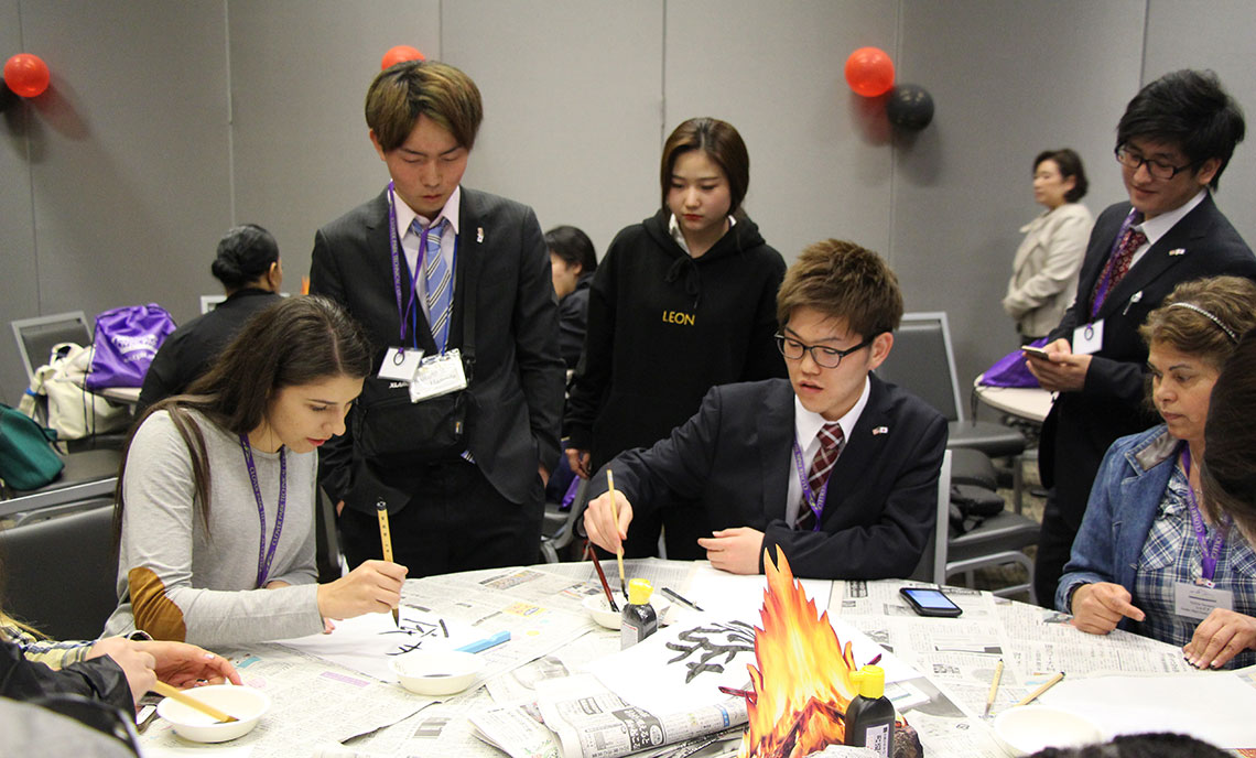 Osaka Jikei students teach CPTC students how to write in Japanese Calligraphy.