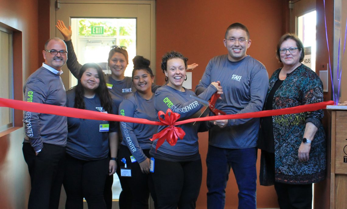 Staff cut the ceremonial ribbon during the CPTC Fitness Center Grand Opening.