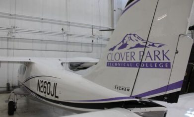 White airplane with CPTC logo on the tail