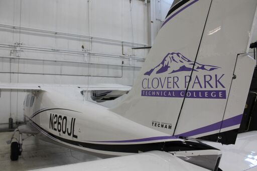 White airplane with CPTC logo on the tail