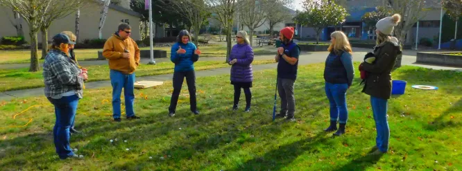 Dr. Faust, Mira Lutz, and Daniel Cuevas walk through a food web class with the teachers