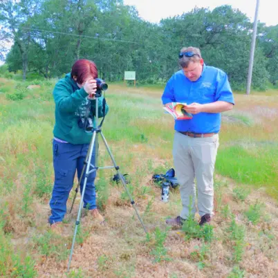 Dr. Faust and Blair Wilson run through the Red Elderberry before the shot starts.  Photo Marcia Wilson